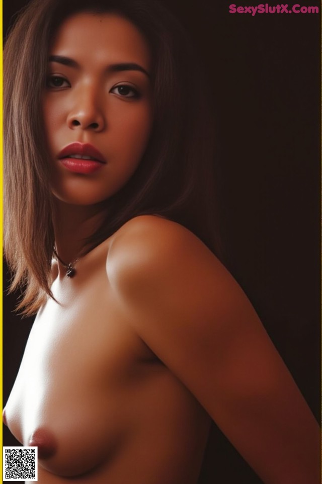 A naked asian woman posing in front of a black background.